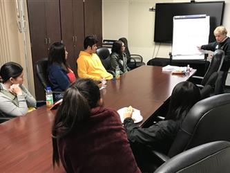 Student Governing Board/Assembly Group Listening to Facilitator