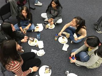 Student Governing Board/Assembly Group Sitting on Carpeted Floor having Lunch